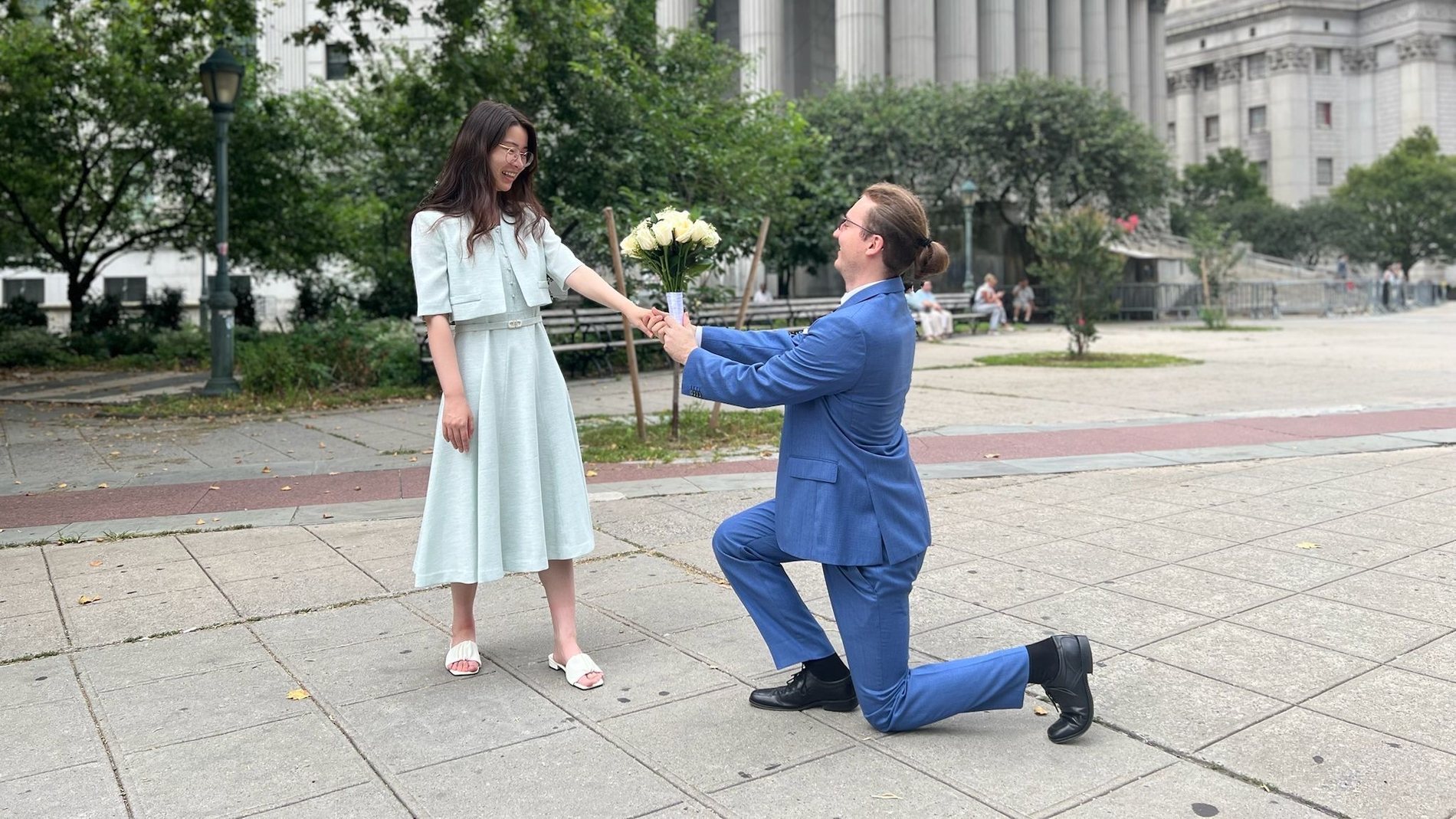 Tomasz kneeling to propose to Sharon
