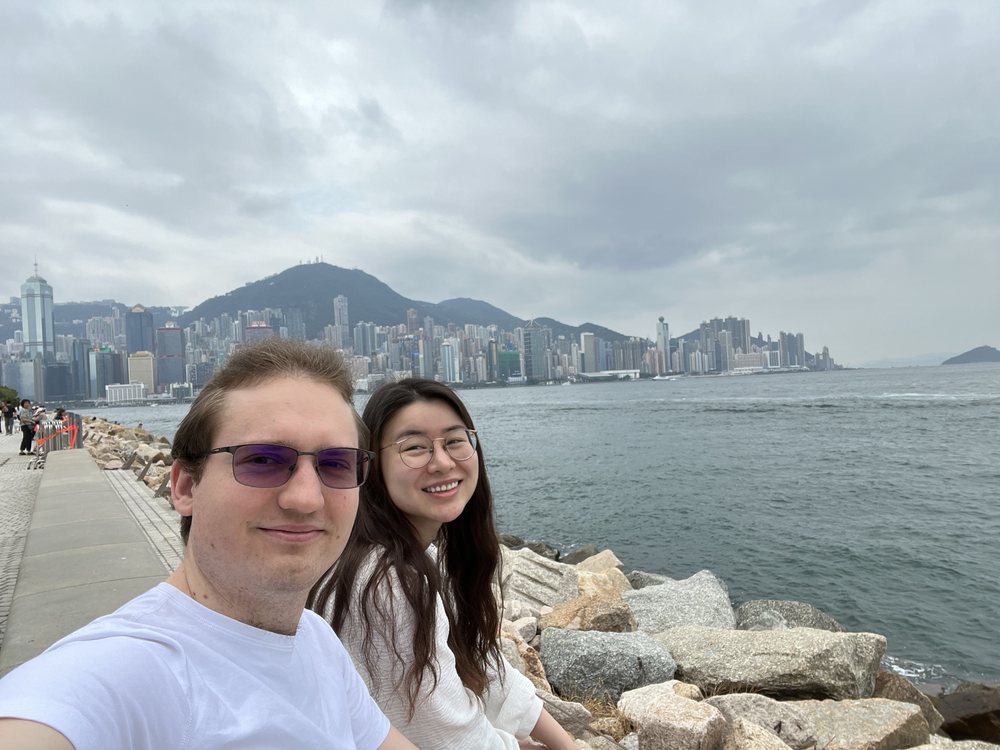 Sharon and Tomasz by the water in Hong Kong