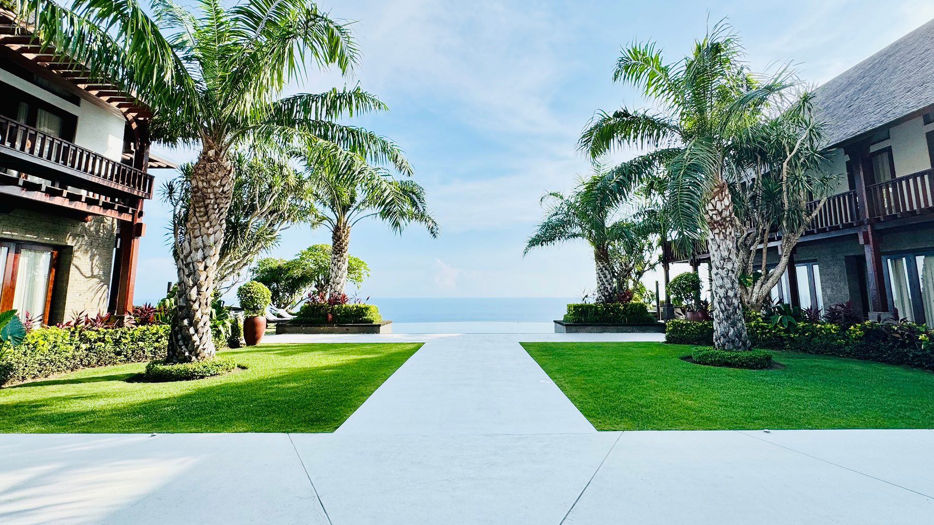 Lawn and palms on the clifftop above the Indian Ocean